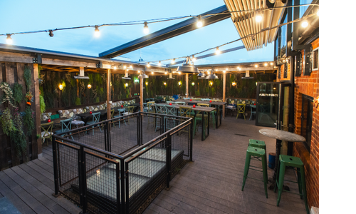Outdoor seating at Market House, Reading under fairylights